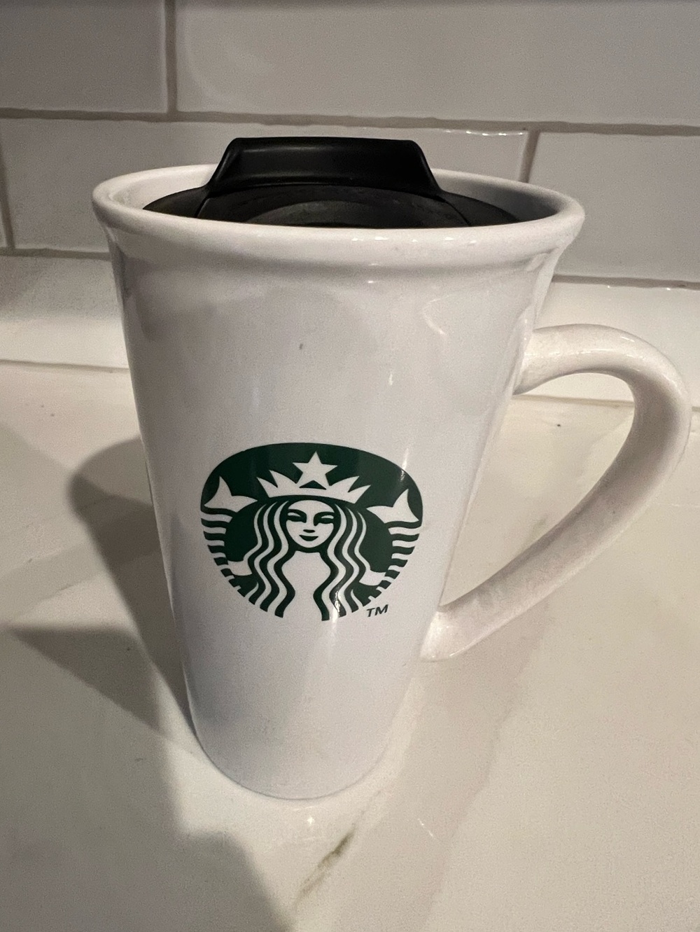 Starbucks White Ceramic 16oz Travel Mug with spill resistant lid.